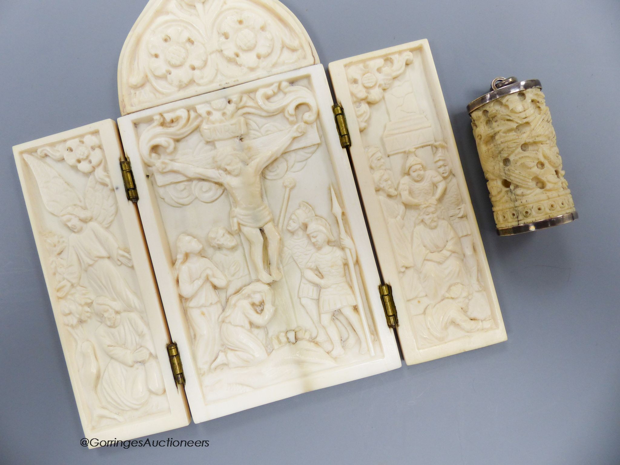 A carved ivory triptych, early 20th century and a carved ivory cover